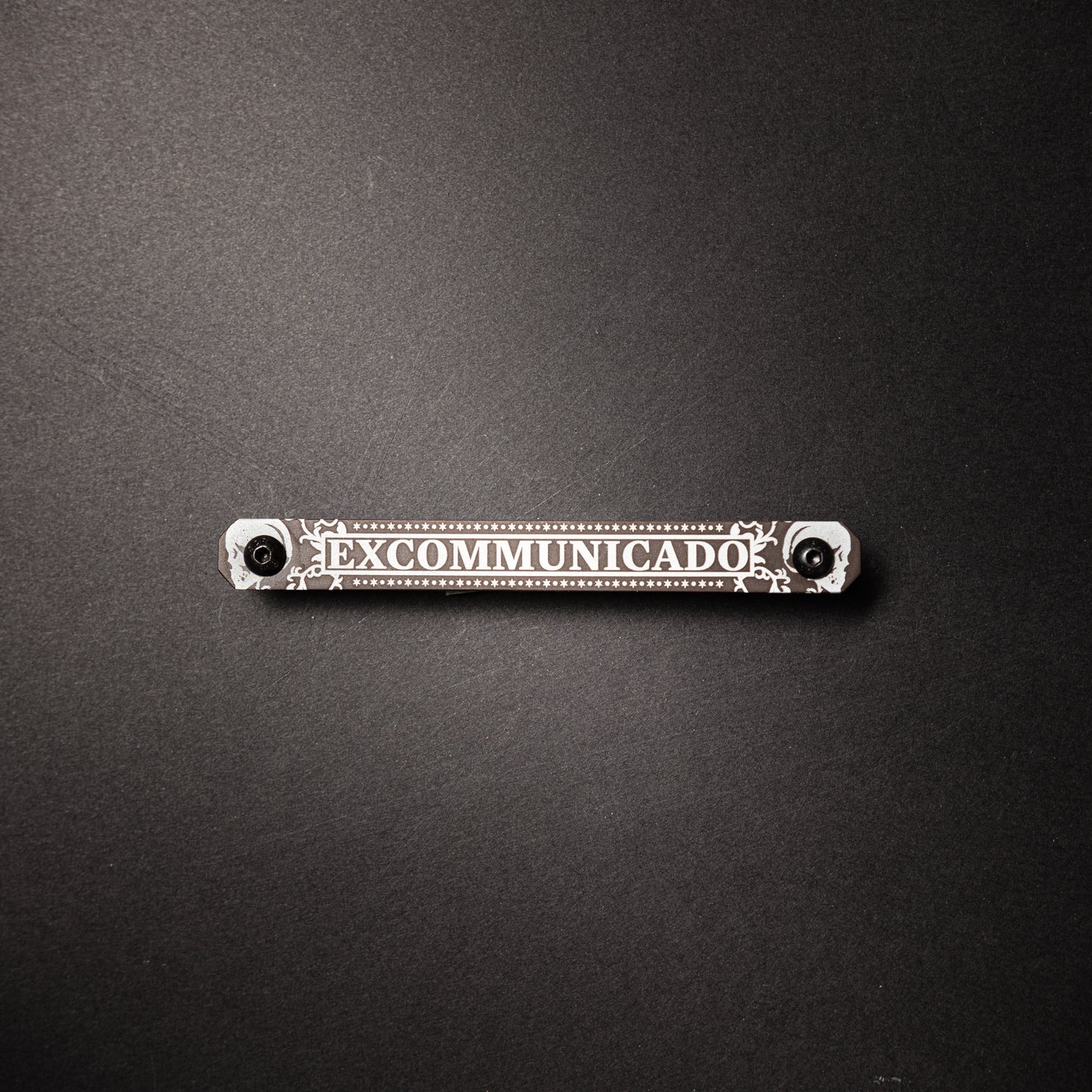 Excommunicado Version 1-Large Tag
